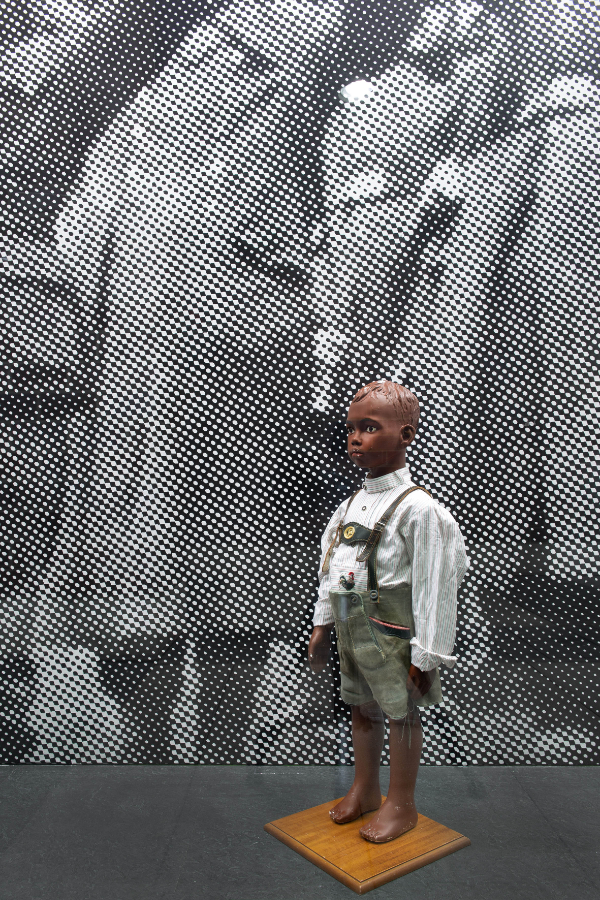 James Gregory Atkinson, Your Job in Germany (Detail), 2021, wall paper, mannequin, lederhosen, installation view, ‘6 Friedberg-Chicago’, Dortmunder Kunstverein  Courtesy: the artist, Dortmunder Kunstverein Photo: Jens Franke